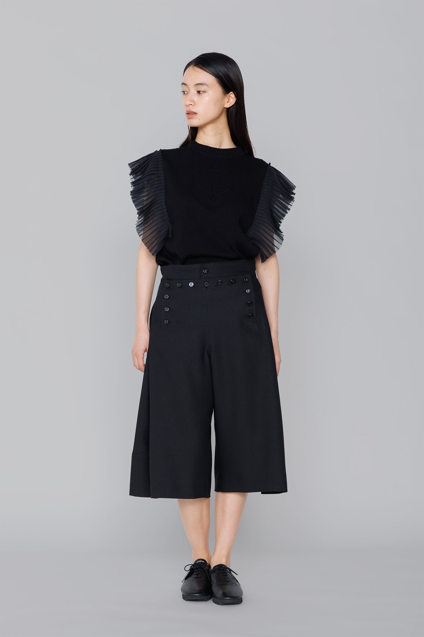 SLEEVELESS PLEATED GUERNSEY KNIT