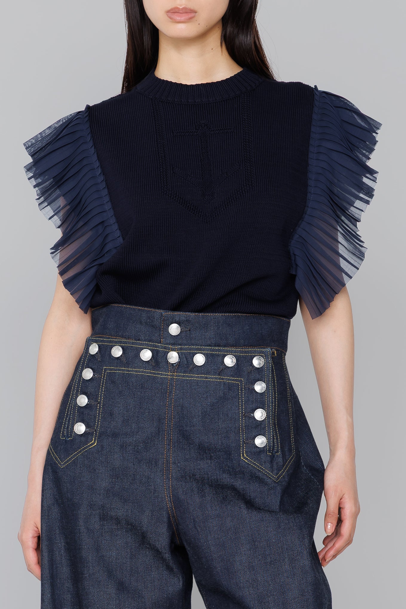 SLEEVELESS PLEATED GUERNSEY KNIT